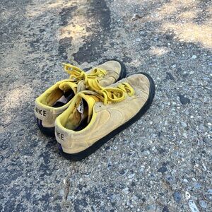 Nike SB sneakers in a mustard yellow